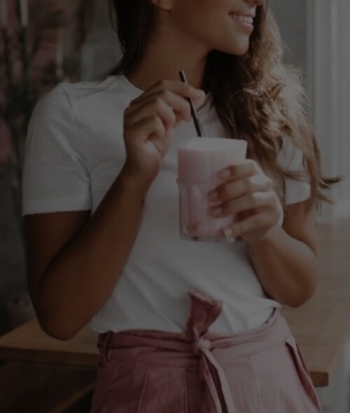 woman drinking smoothie