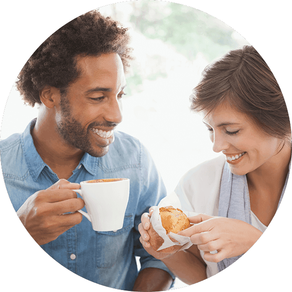 happy couple eating breakfast
