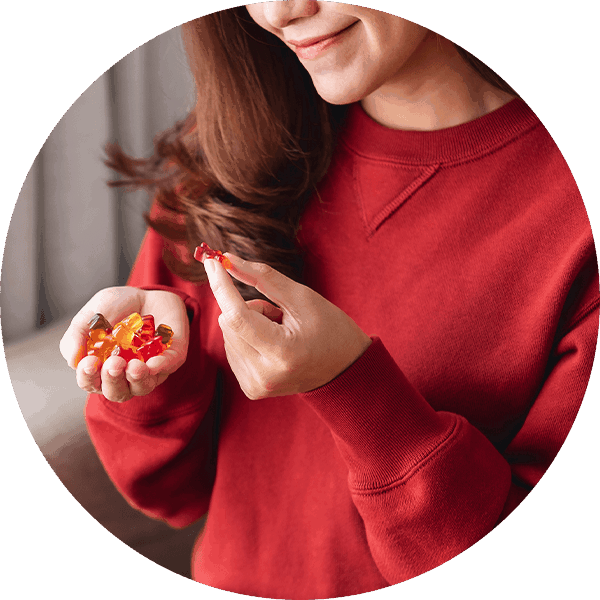 woman eating nutritional gummy