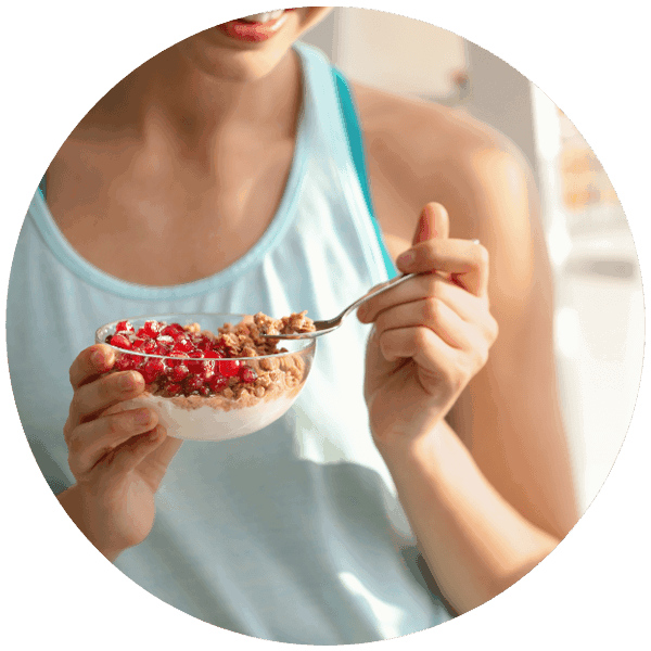 healthy woman eating granola