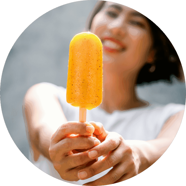 happy woman with orange popsicle