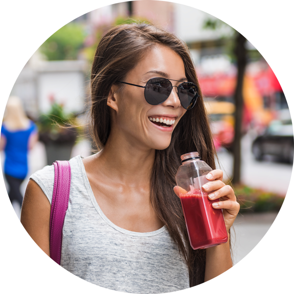 happy woman eating pressed juice