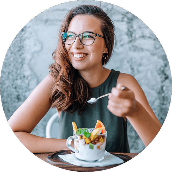 happy woman eating yogurt